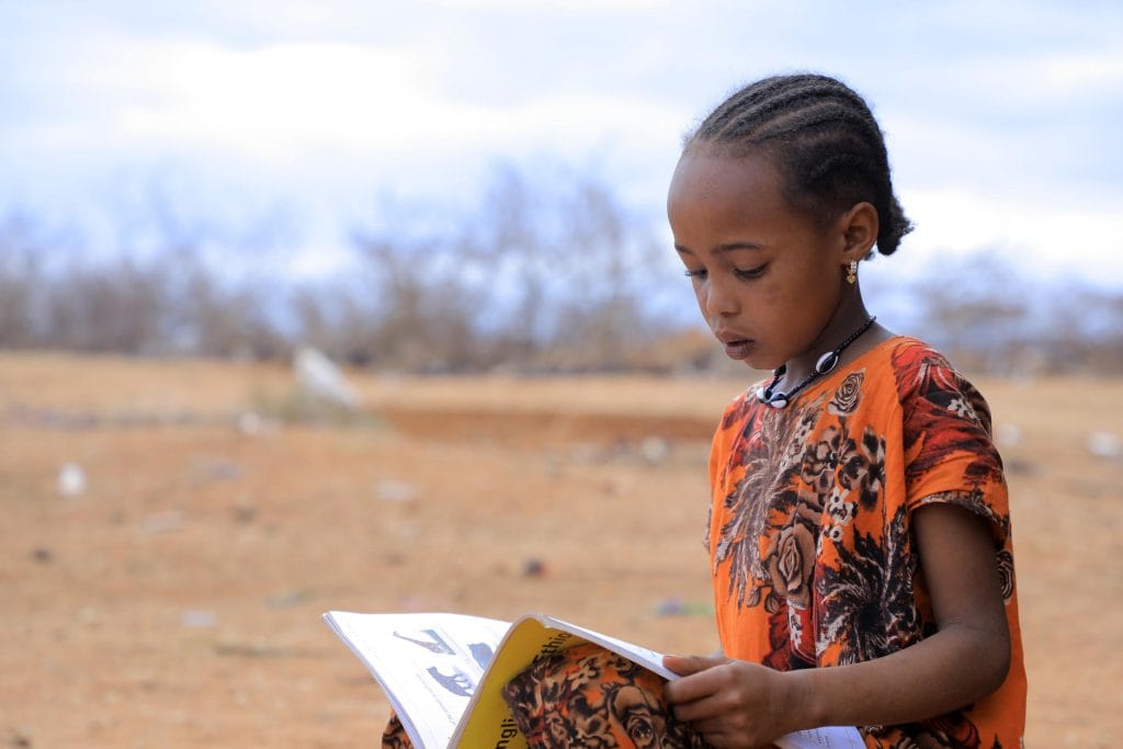 Jilo, 10, studies at her home in Borena zone, Oromia region | Ambienta