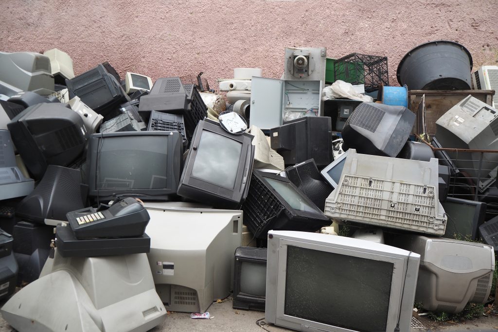 Electronic waste. Out of use monitors and televisions. Recycling industry. Mixed-plastic waste in electronics. | Ambienta